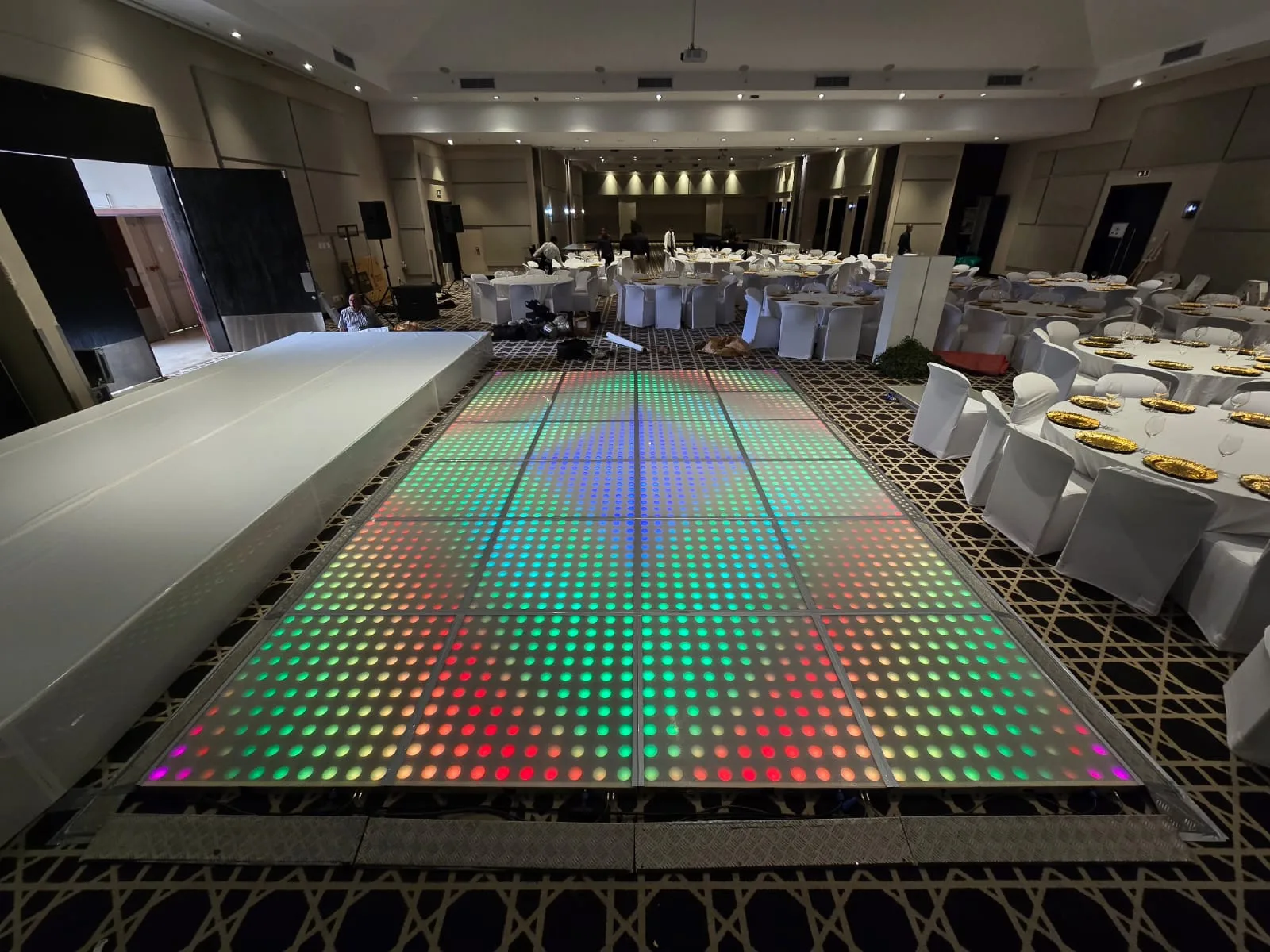 Illuminated LED dance floor at a formal venue
